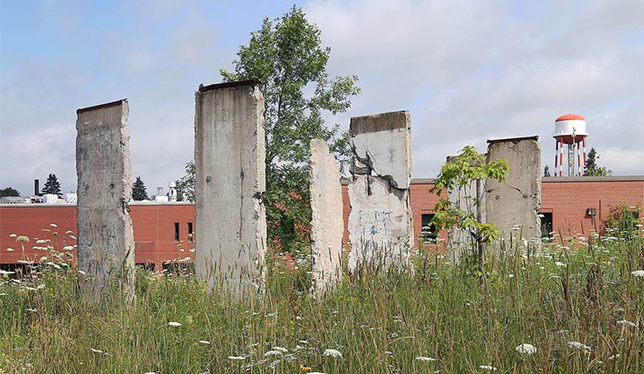 Six 12’ x 4’ panels of the Berlin Wall now reside on the Dalhousie Agricultural Campus in Bible Hill, N.S. Photos by Vid Ingelevics.