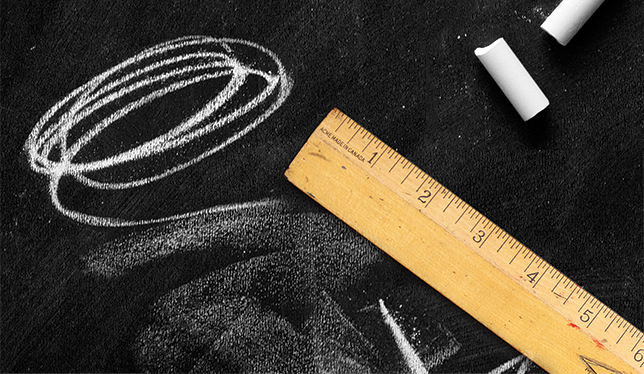 scale and chalk on black sheet