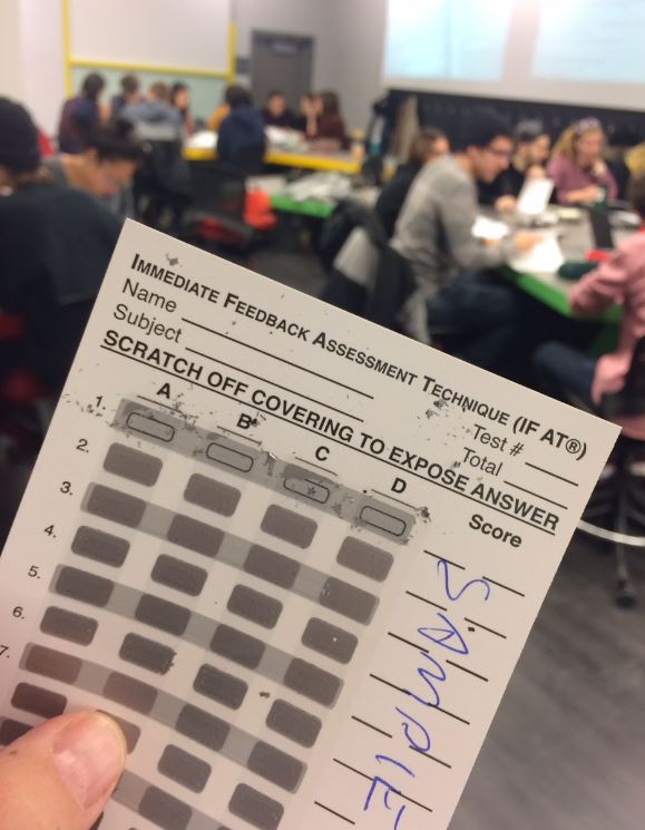 Students working in group quizzes using IF-AT cards.