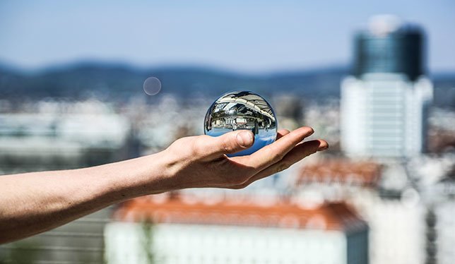 Glass ball on hand